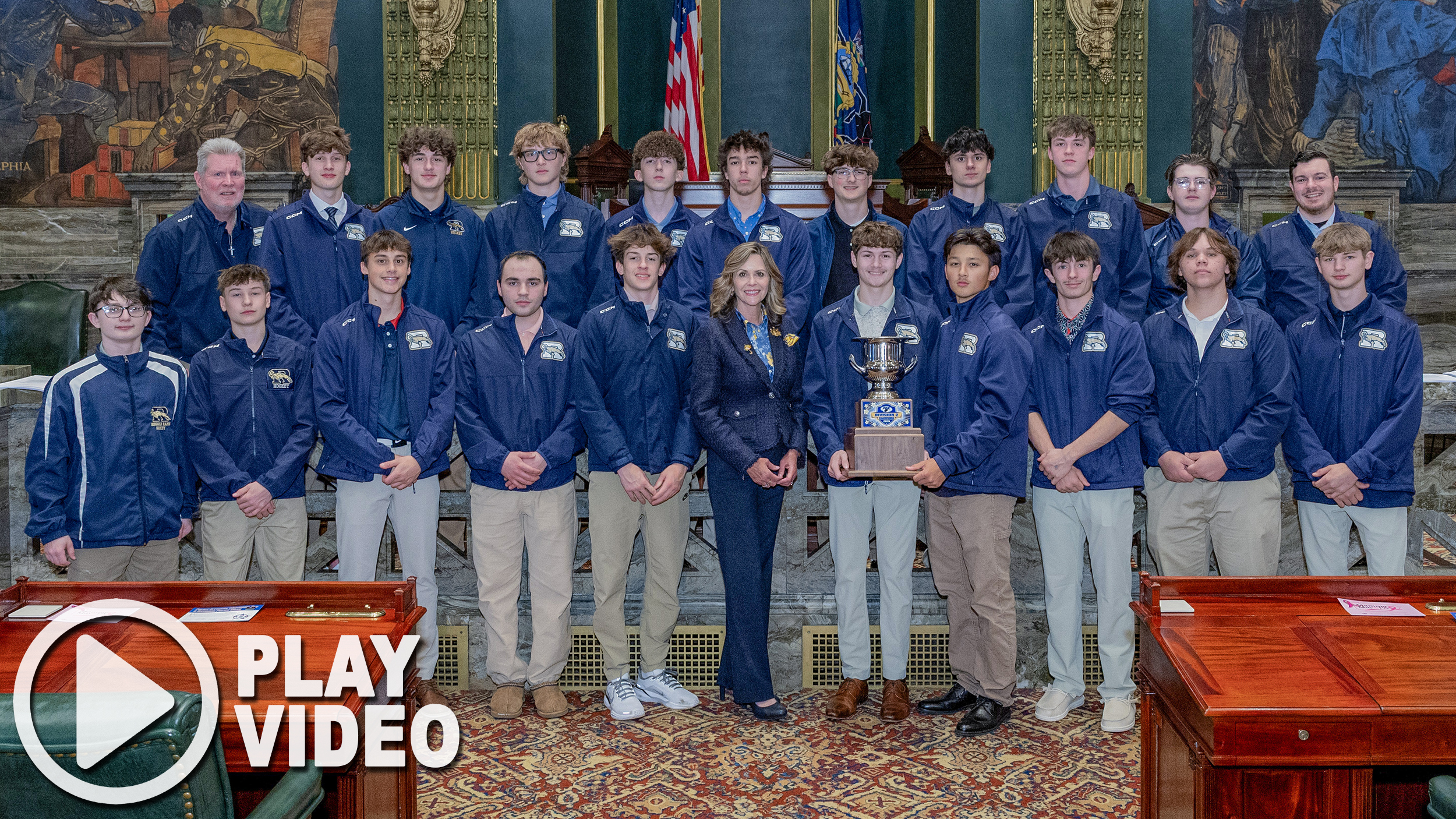 Sen. Bartolotta poses with the Ringgold Hockey Team and the state championship trophy.