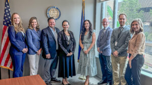 Sen. Bartolotta poses with a group of people in her district office.