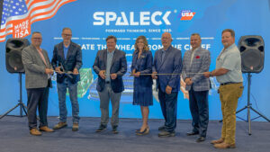 Sen. Bartolotta poses with a group of people ready to cut a ceremonial ribbon at the new Spaleck facility.