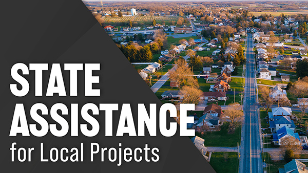 Text that says, “State Assistance for Local Projects” is overlayed onto a photo of a neighborhood.