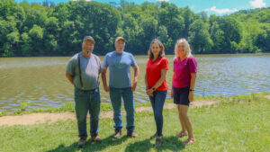 Sen. Bartolotta poses with Ethan Ward, Michael Curtis and Jerri Zwicker in at the shoreline of Dutch Fork Lake.