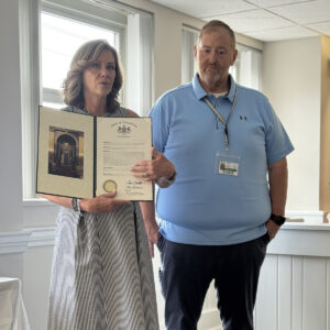 Sen. Bartolotta reads a proclamation as Jeff Marshall stands next to her.