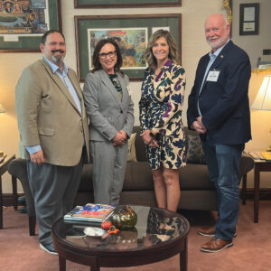 Sen. Bartolotta poses with Christopher and Christine Musuneggi, and Greg Snyder inside of her Harrisburg office.